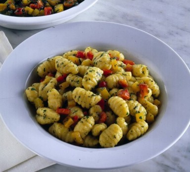 Potato gnocchi with red onions and peppers